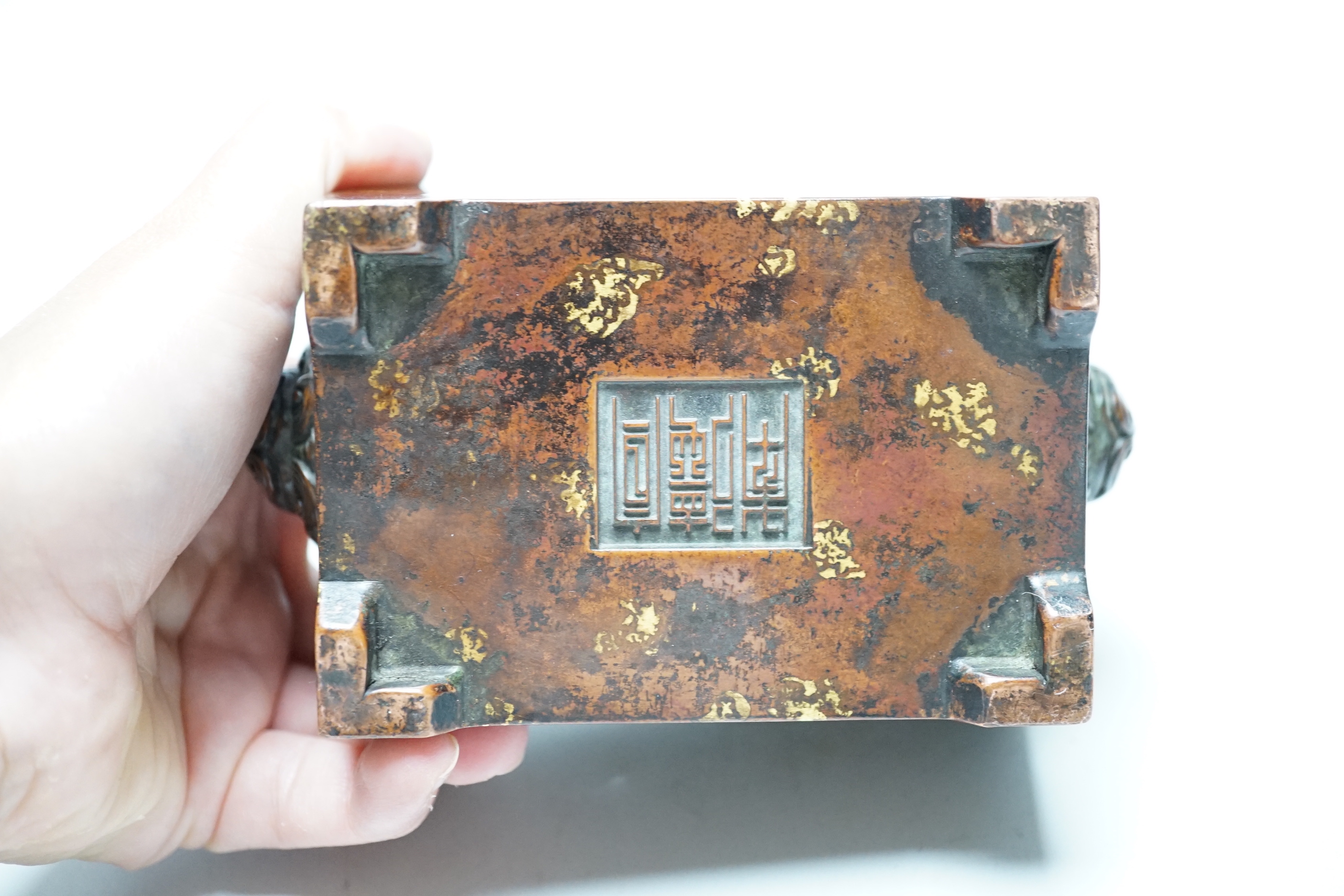 A Chinese gold splash bronze censer, fangding, 7cm tall